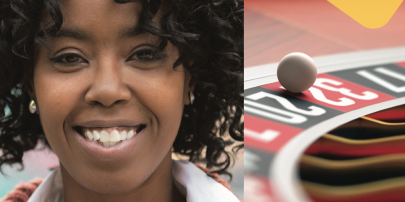 Person smiling. Close up of a ball falling into a roulette wheel.